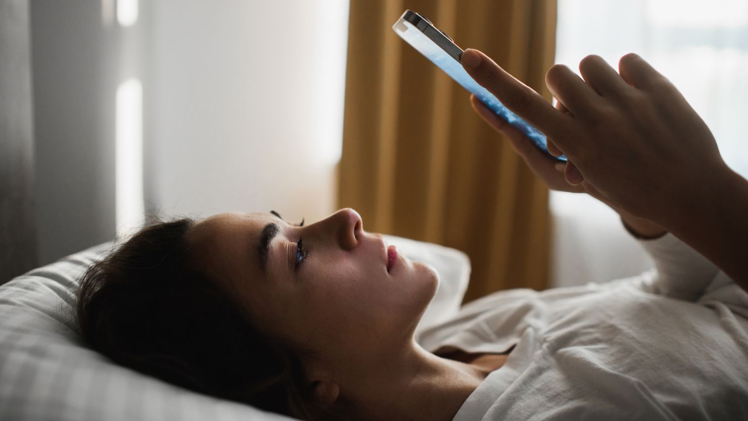 Wasting time in smartphone. Millennial generation mental health. Life in metaverse, not in real world. Conceptual of bad condition of broken hearted, sadness, loneliness or depress woman.